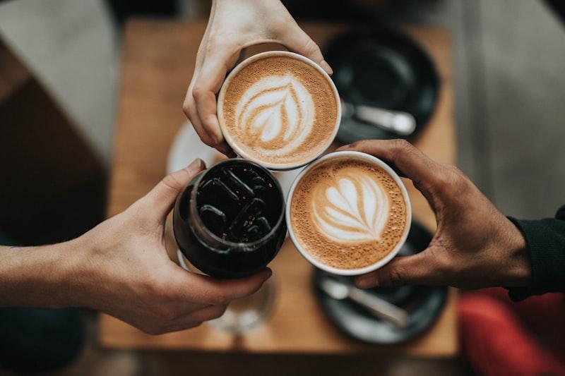Creamy hot cappuccino in gold cup